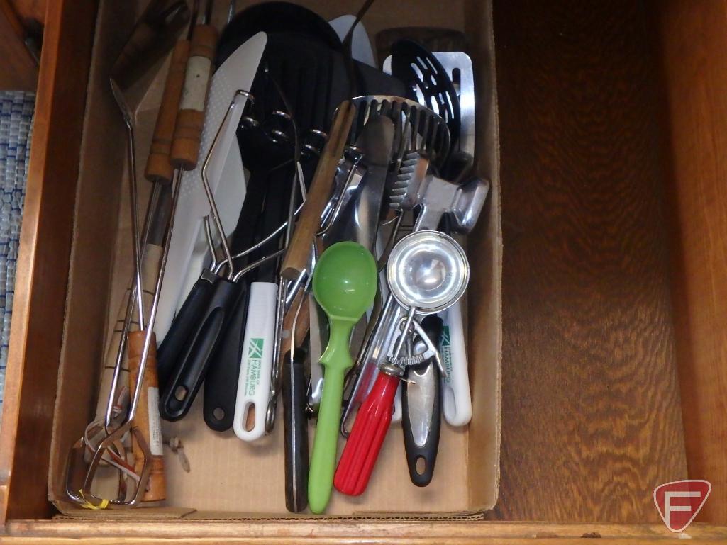 Assortment of silverware, not matching, potholders, knives, kitchen utensils. All 4 drawers