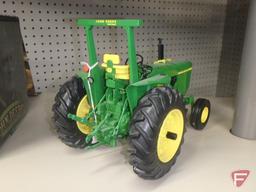 Ertl replica John Deere 4000 diesel tractor with commemorative coin.