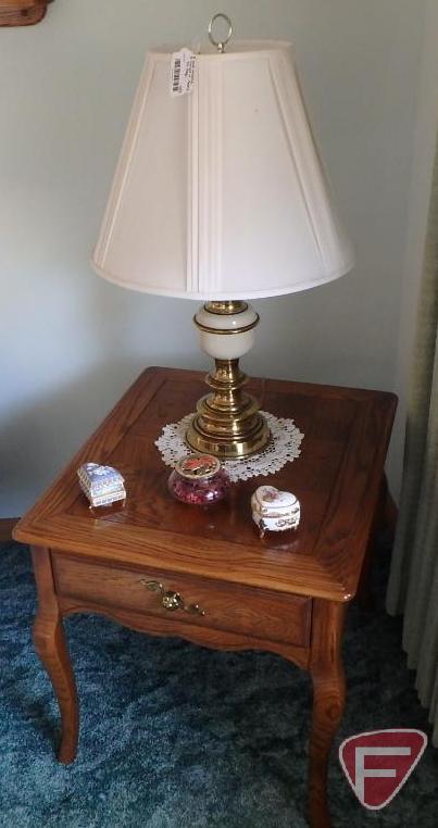 Wood end tables with drawers, matching table lamps, and knick knacks.