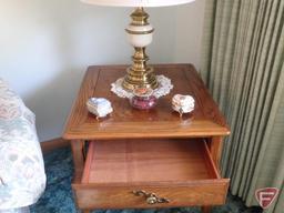 Wood end tables with drawers, matching table lamps, and knick knacks.