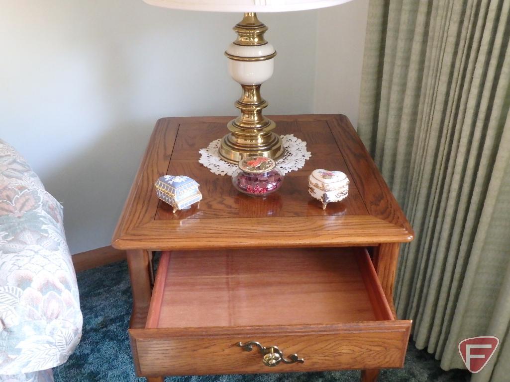 Wood end tables with drawers, matching table lamps, and knick knacks.