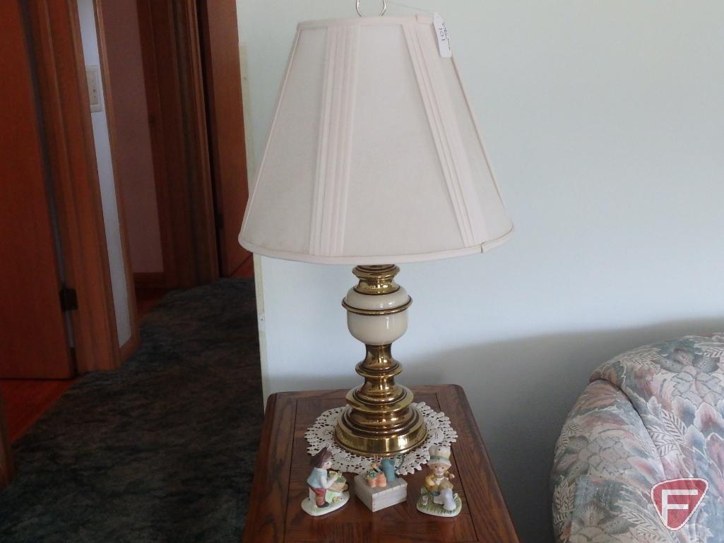 Wood end tables with drawers, matching table lamps, and knick knacks.