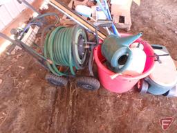 Bird houses, garden hose cart, garden hose, plastic bushel tub, sprinkler head, hand sprayer