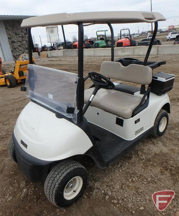 2016 EZ-GO RXV electric golf car with canopy, windshield, and cooler; white