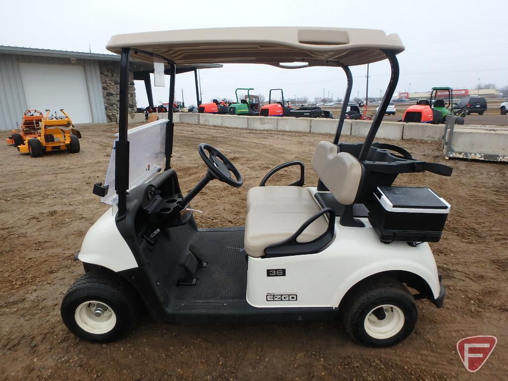 2016 EZ-GO RXV electric golf car with canopy, windshield, and cooler; white