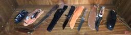 Knives: Brasil, Gerber, and others, most have sheaths. Contents of shelf.