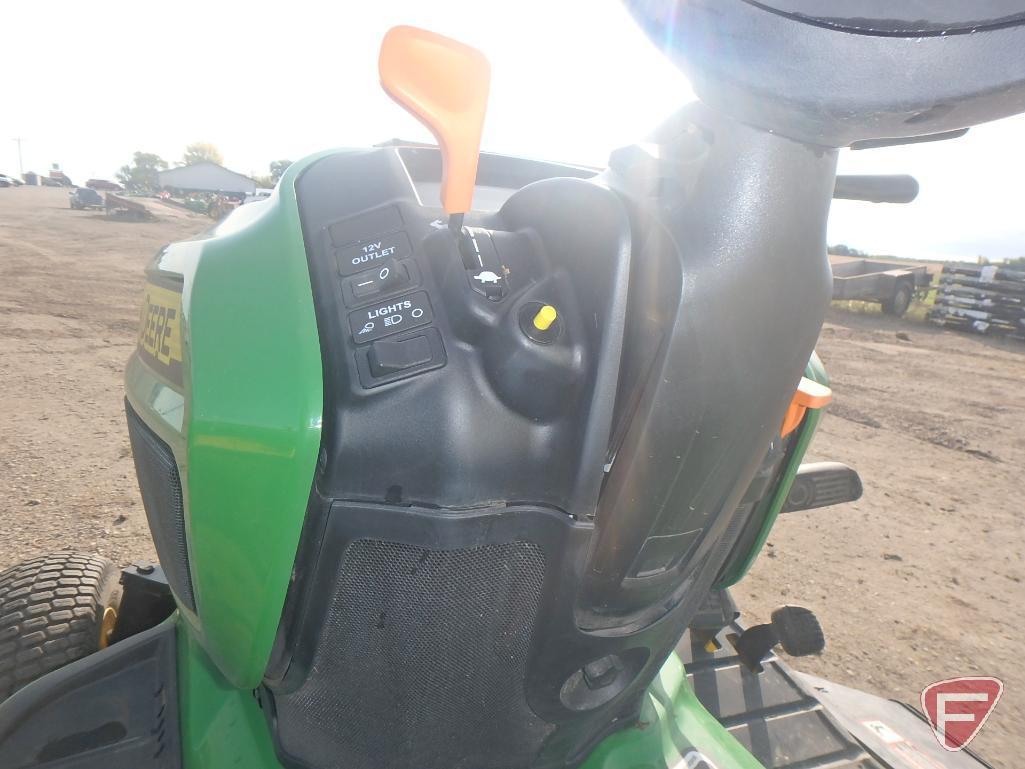 John Deere X734 60" riding mower, 714 hrs.