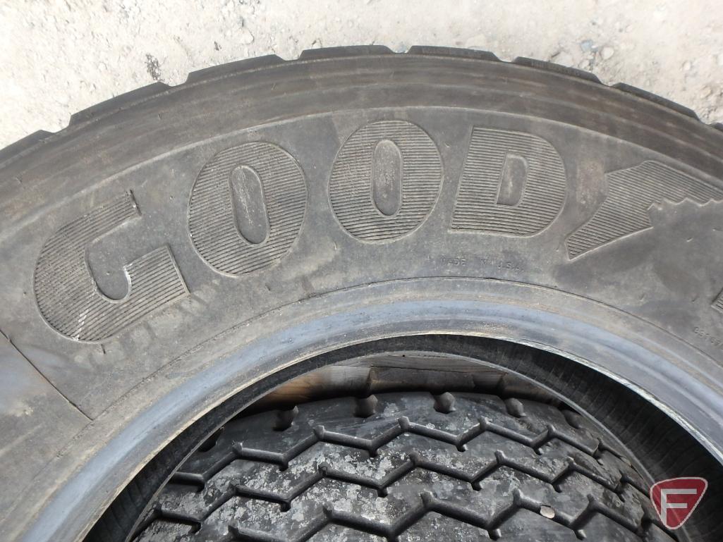 (2) Goodyear tires 11 r 22.5, one mounted on a rim