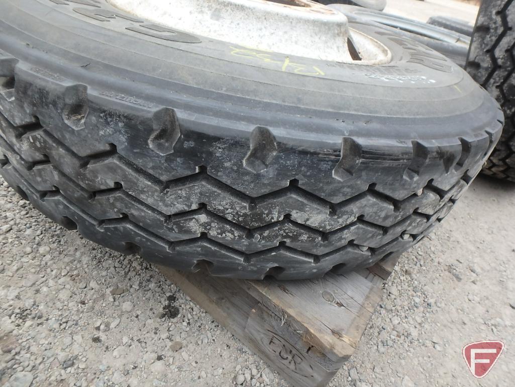 (2) Goodyear tires 11 r 22.5, one mounted on a rim