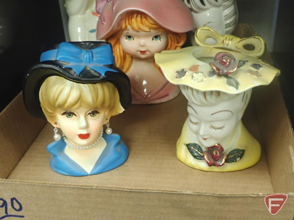 Head vases, girl with pink hat is 6"h, lady with green hat 8"h. 2 boxes