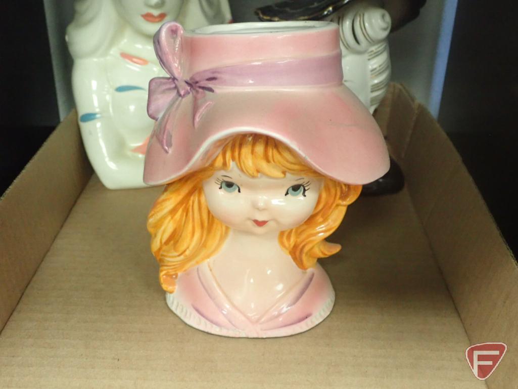 Head vases, girl with pink hat is 6"h, lady with green hat 8"h. 2 boxes