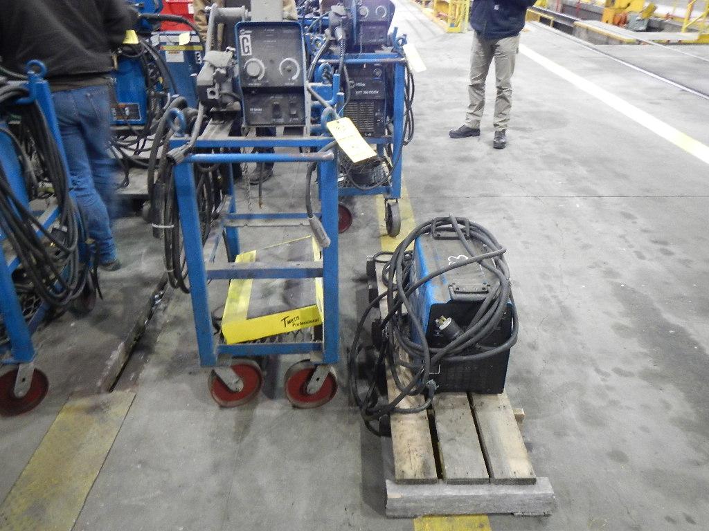 MILLER XMT 350 WELDER WITH MILLER 70 SERIES WIRE FEEDER,  MIG GUN, ON ROLL-