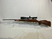 WEATHERBY MARK V With scope and Rings.  240 Win Mag.Barrel shows rust as we