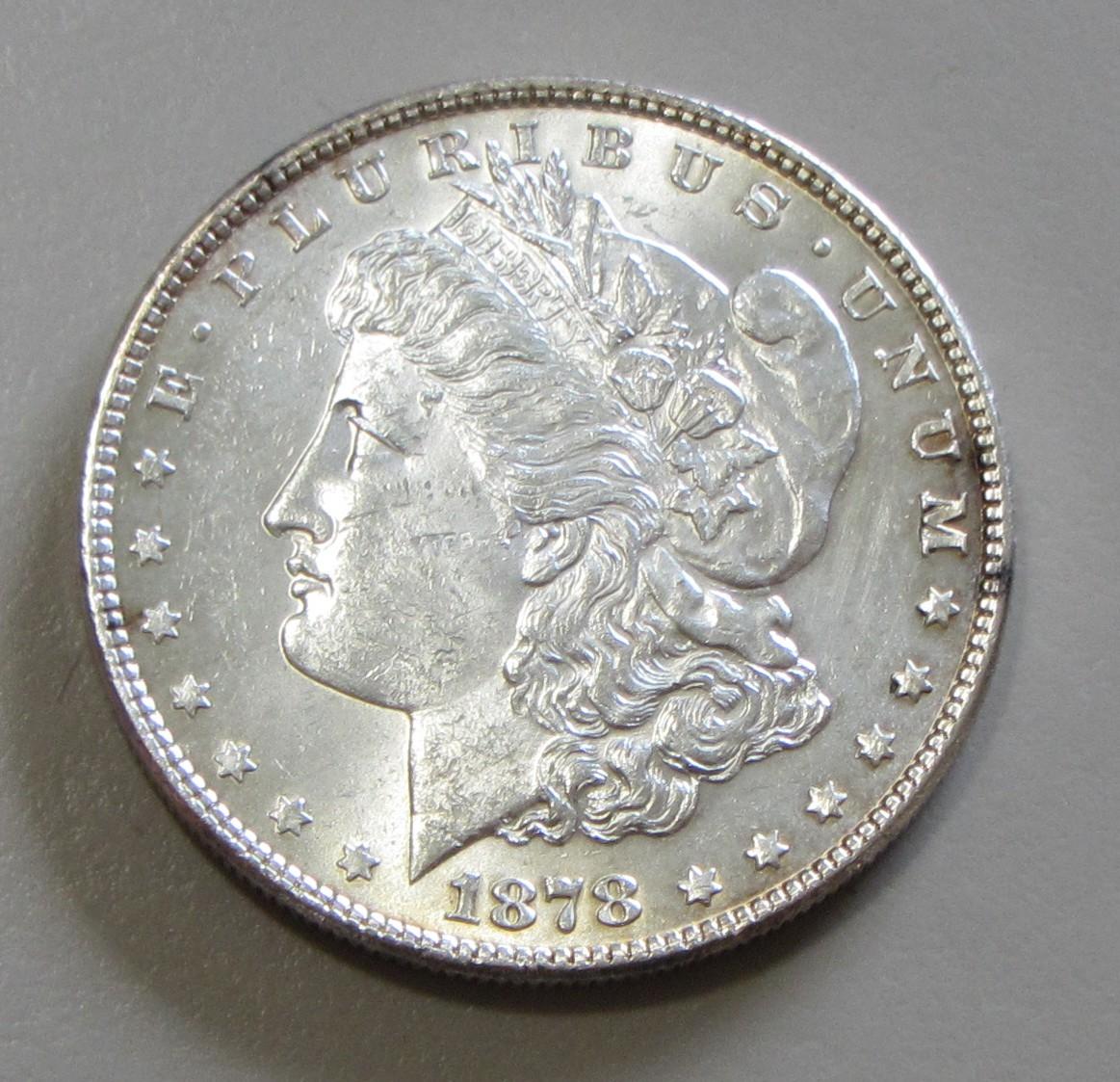 BU $1 MORGAN 1878 7 FEATHERS