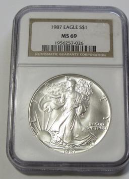 $1 1987 SILVER EAGLE NGC 69