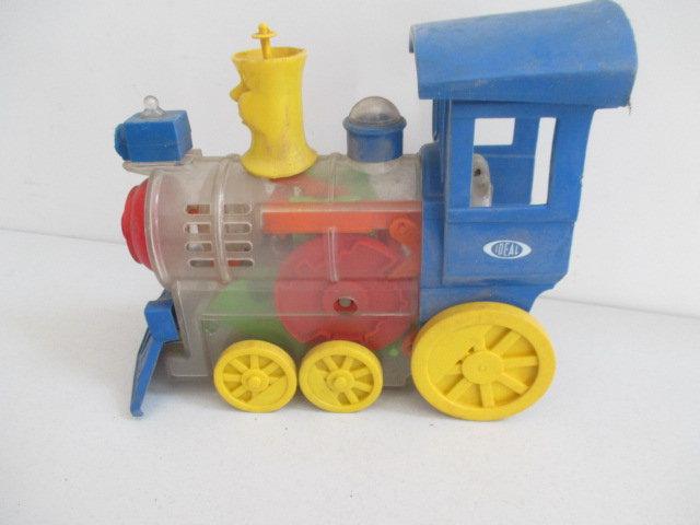 Tin Robot on Swing, 1974 Ban & Hrico Robot Metal Bank and Ideal See-Through Train Engine