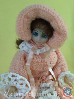 HANDCRAFTED DOLL, 15" tall on wood stand, crochet dress and cloak.