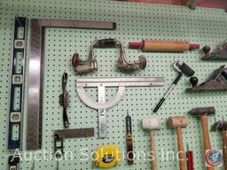 contents of pegboard to include assorted hammers, saws, levels and other hand tools (pegboard not