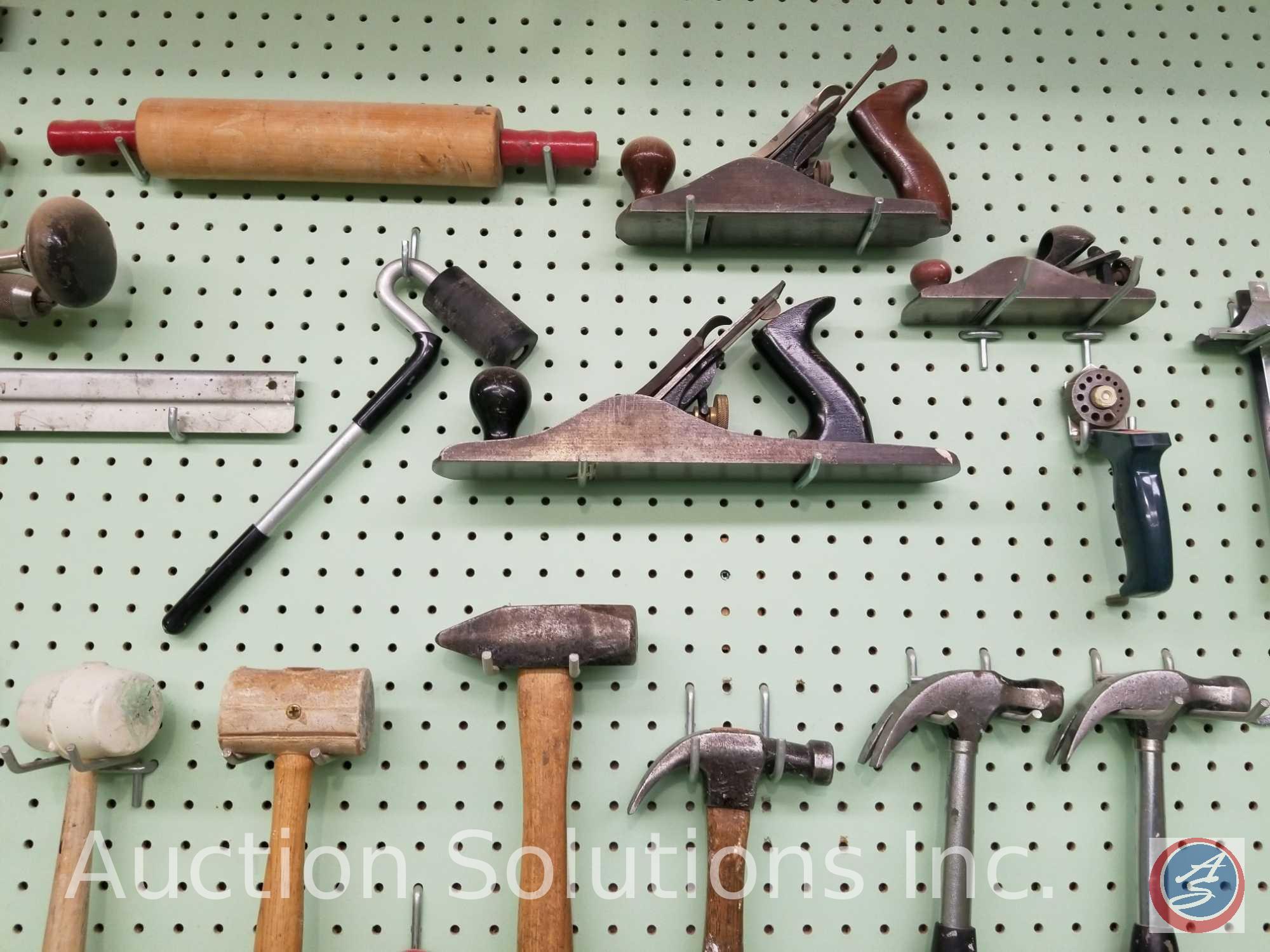 contents of pegboard to include assorted hammers, saws, levels and other hand tools (pegboard not