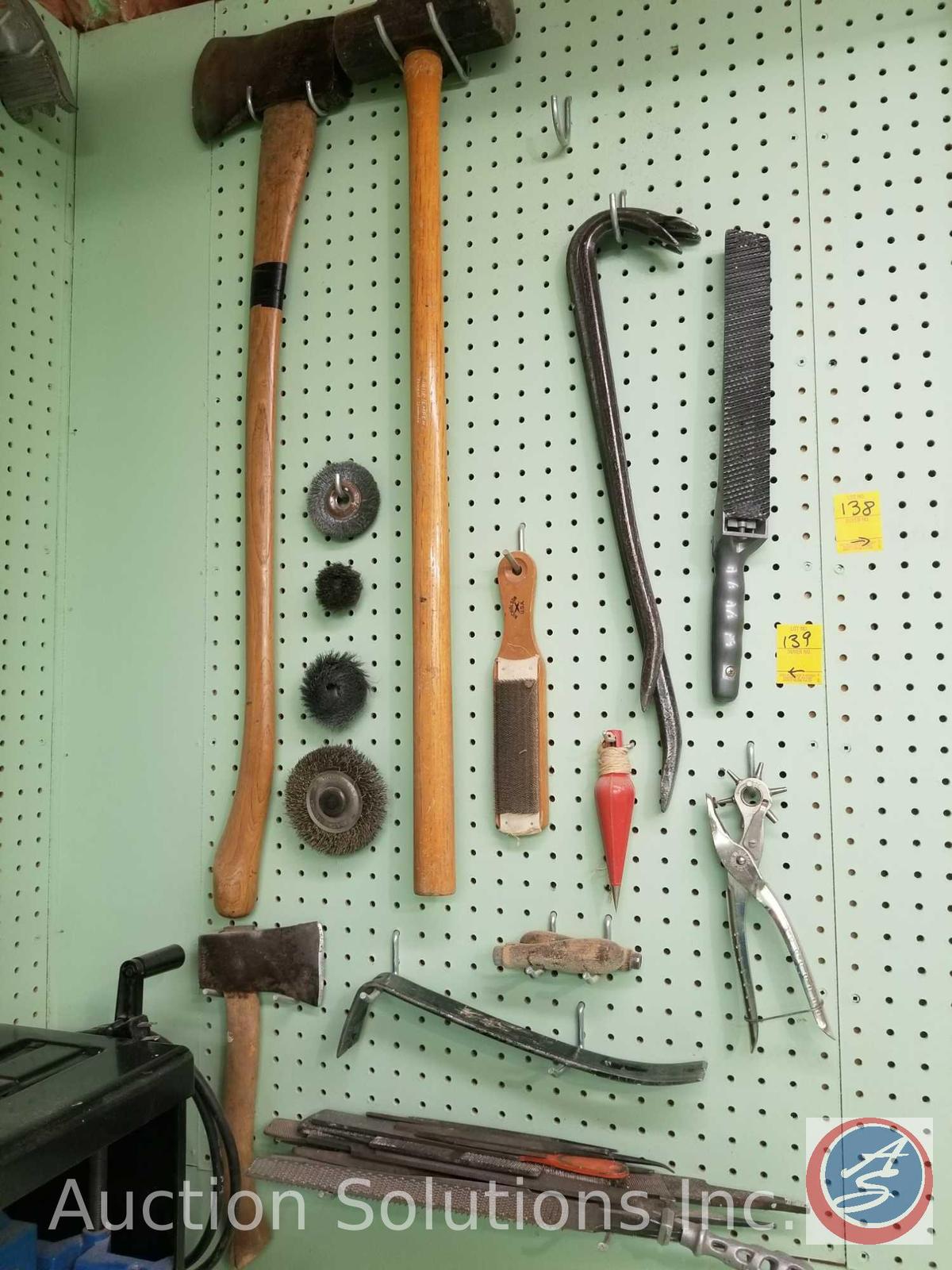 contents of pegboard to include ax, sledgehammer, files, grinding wheels, pry bars and more