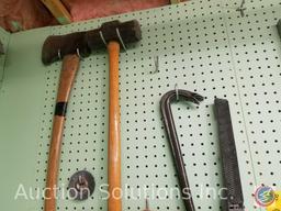 contents of pegboard to include ax, sledgehammer, files, grinding wheels, pry bars and more