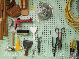 contents of pegboard to include multimeter rivet tool, cable stripper, work lights, leather tool