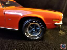 Ertl die cast Chevy Camaro, orange in color