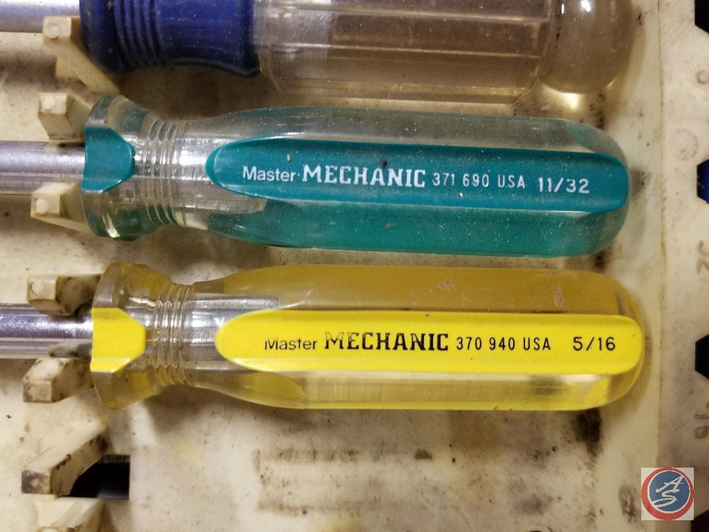 Assorted sizes of hex head Master Mechanic screwdrivers, putty knives, level, files, AC Delco oil