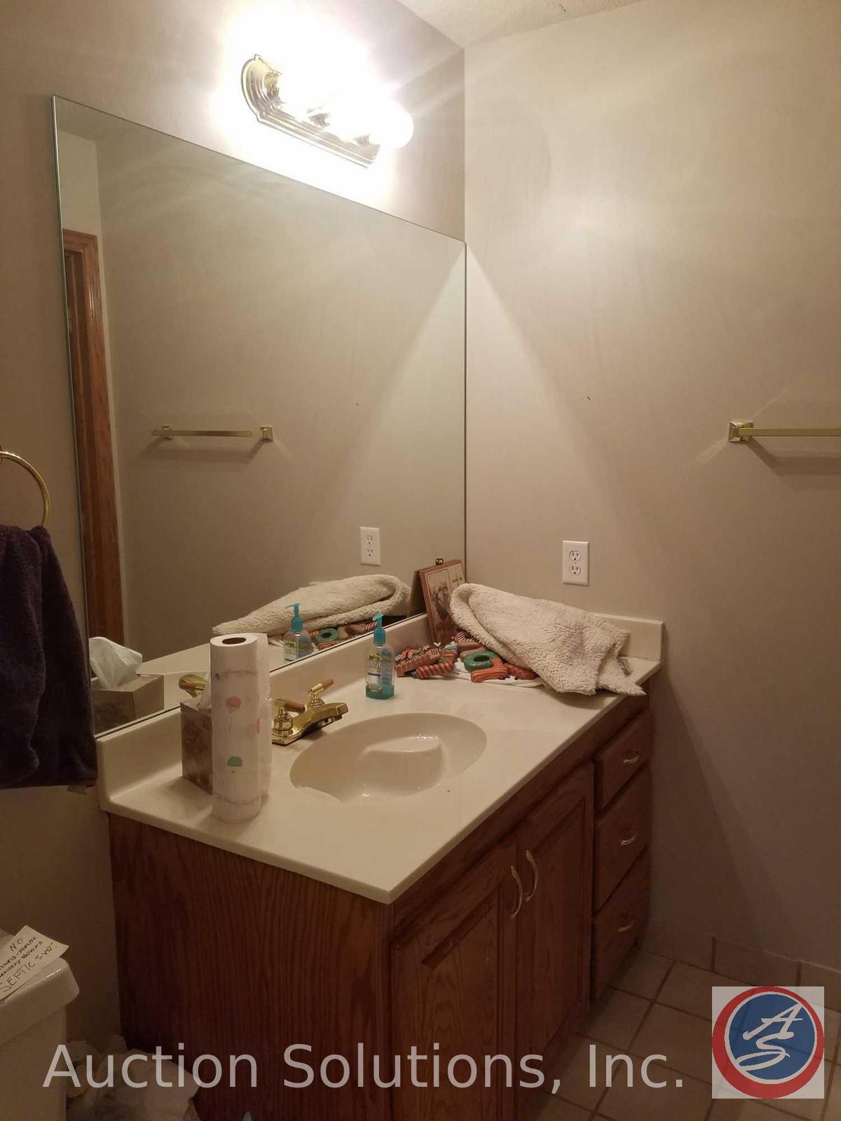 Salvage rights to Basement Bathroom including; Cabinets, Mirror, Sink, Toilet, Shower, Lighting