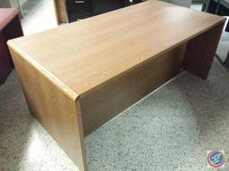 Light brown desk w/ [4] drawers measuring 6ftx3ftx2.5ft