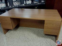 Light brown desk w/ [4] drawers measuring 6ftx3ftx2.5ft