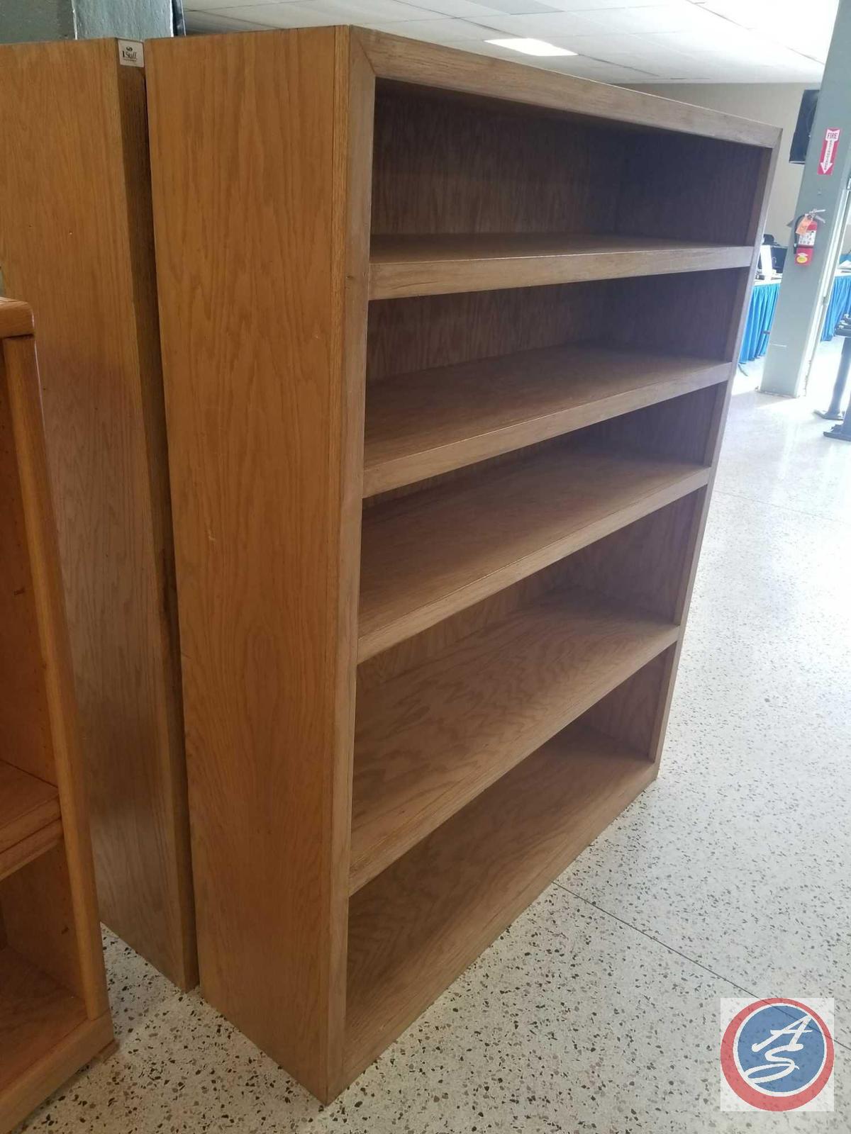 Light brown bookshelf w/ [5] shelves measuring 4ftx1.5ftx5ft