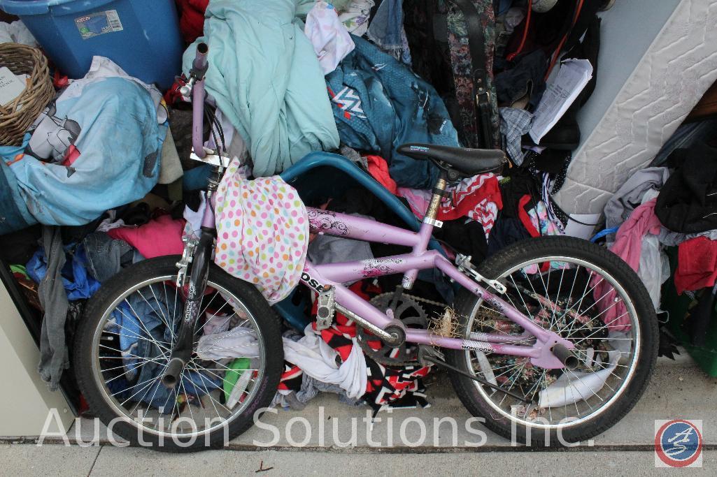 10x10 unit containing children's bicycles, Sanyo flat screen TV, vacuum, luggage, mattress and box