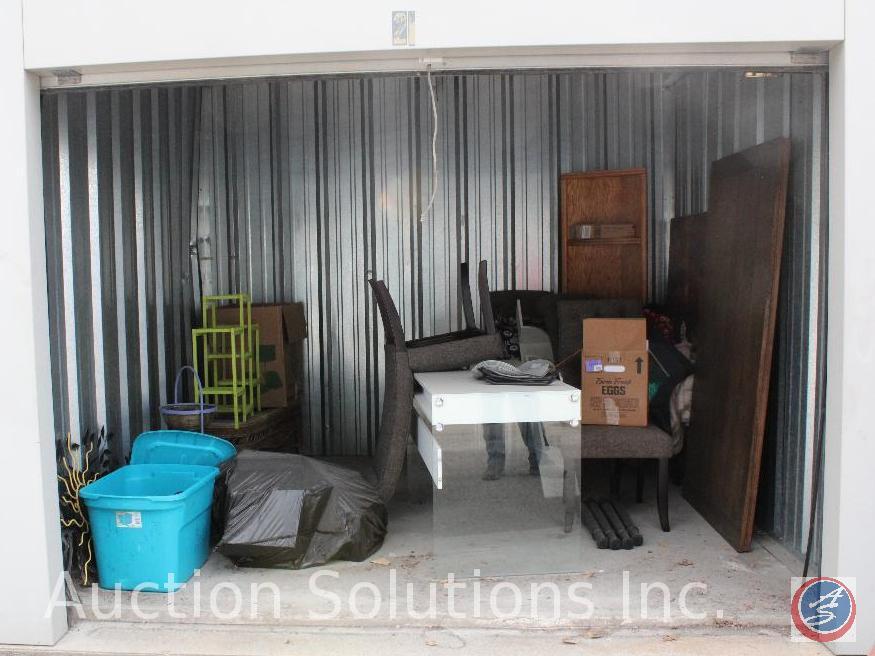 10x10 unit containing a modern desk, 4 upholstered dinning chairs, wood corner bookshelf, empty