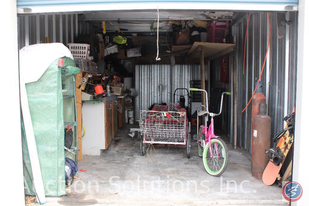 10x20 unit containing girls bicycle, snow board, air tanks, assorted tools, Stihl FS90R weed eater,