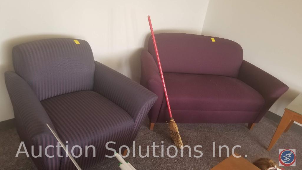 Maroon love seat and a purple and black striped chair