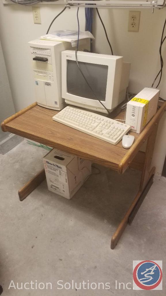 Punch down blocks, data rack, vintage server, office chair.