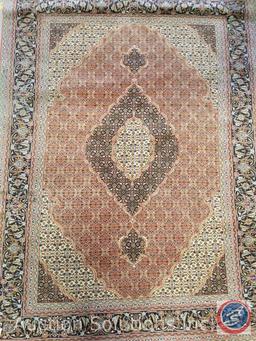 5' x 7' (approx.) Hand knotted Oriental Tabriz rug. Wool fibers tightly knotted onto cotton warp