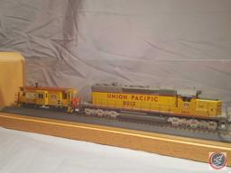 Union Pacific model train #8012 and Union Pacific model train #25842 in glass and wooden display