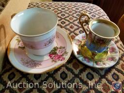 (2) flats containing glass figurines, including (2) teacups on saucers, one marked Norleans Japan, a