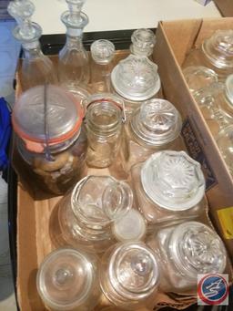 (2) Flats containing an assortment of glass jars with lids, ceramic jar with lid, salt and pepper