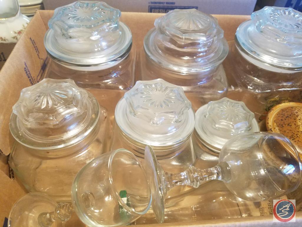 (2) Flats containing an assortment of glass jars with lids, ceramic jar with lid, salt and pepper