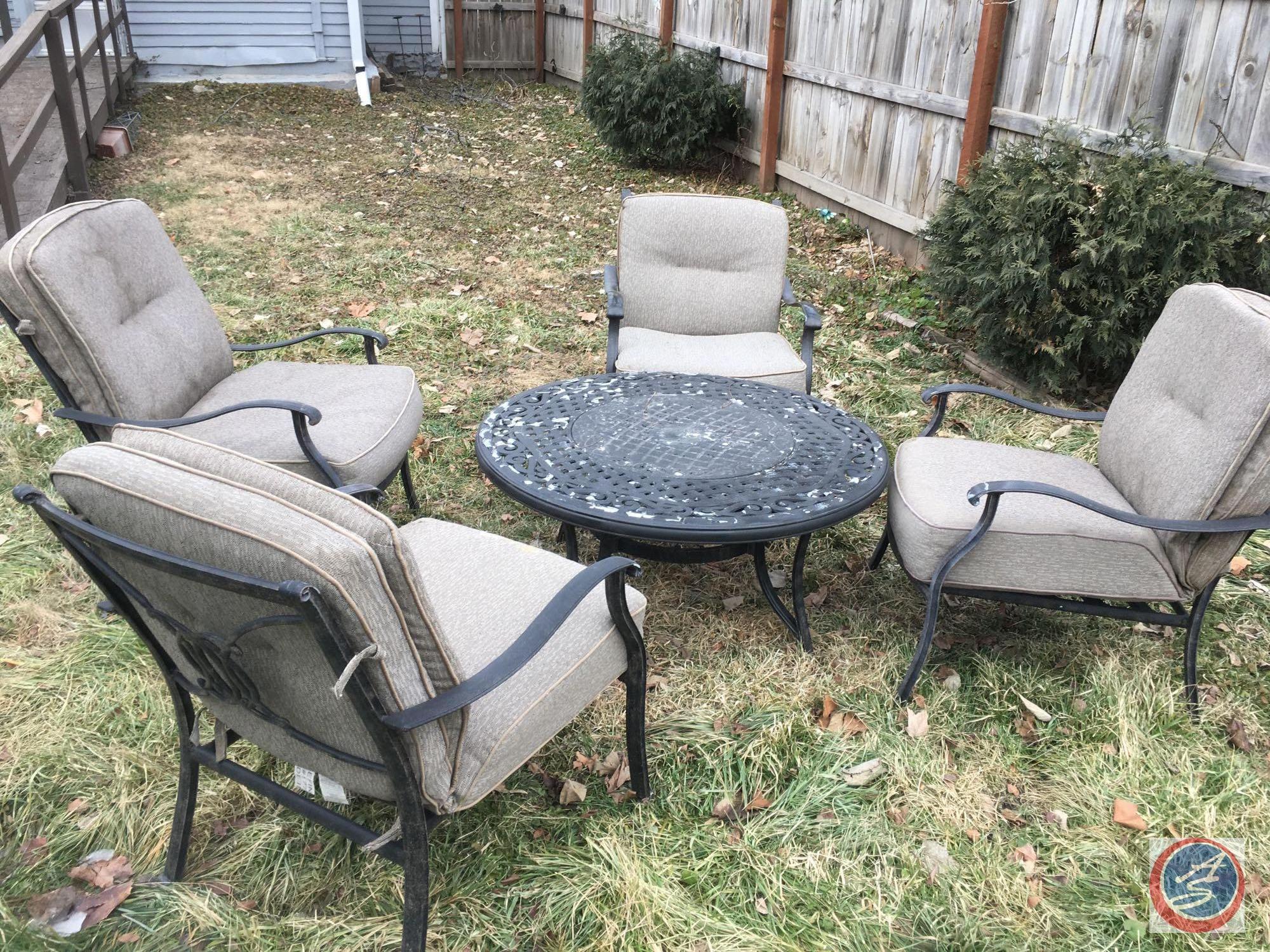 Bistro Set, Outdoor Chairs Windchimes (partially broken) Charcoal Grill, Cinderblock and Board