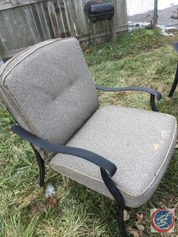 Bistro Set, Outdoor Chairs Windchimes (partially broken) Charcoal Grill, Cinderblock and Board