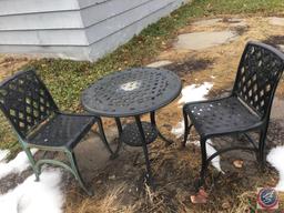 Bistro Set, Outdoor Chairs Windchimes (partially broken) Charcoal Grill, Cinderblock and Board