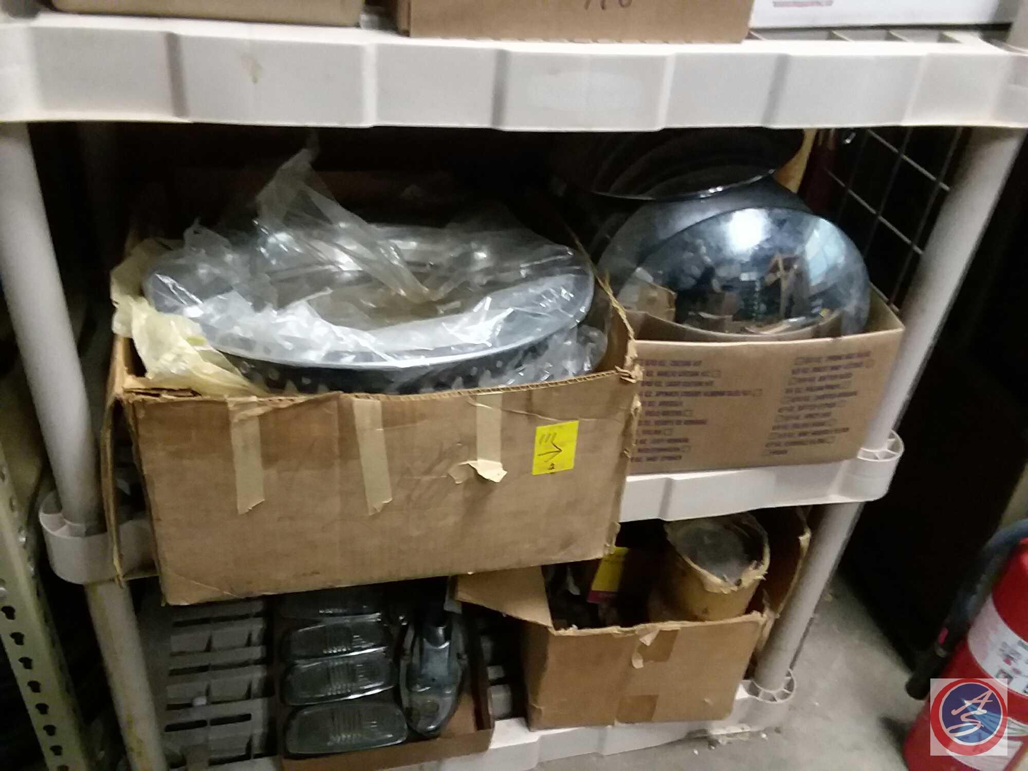 2 boxes of vintage hubcaps