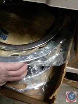 2 boxes of vintage hubcaps