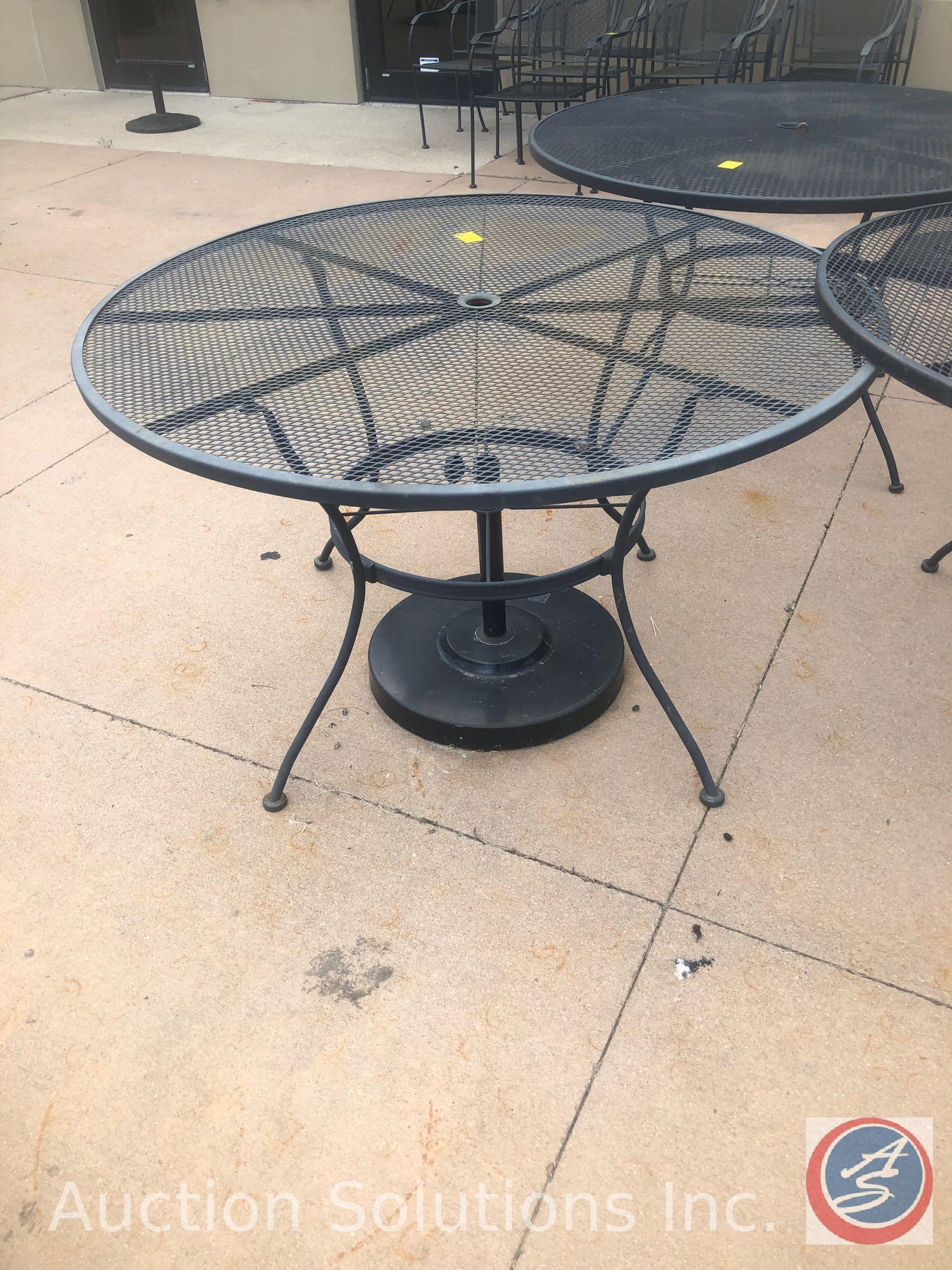 (3) Iron Umbrella Patio Tables 48" {{TWO TABLES HAVE A BROKEN LEG}}