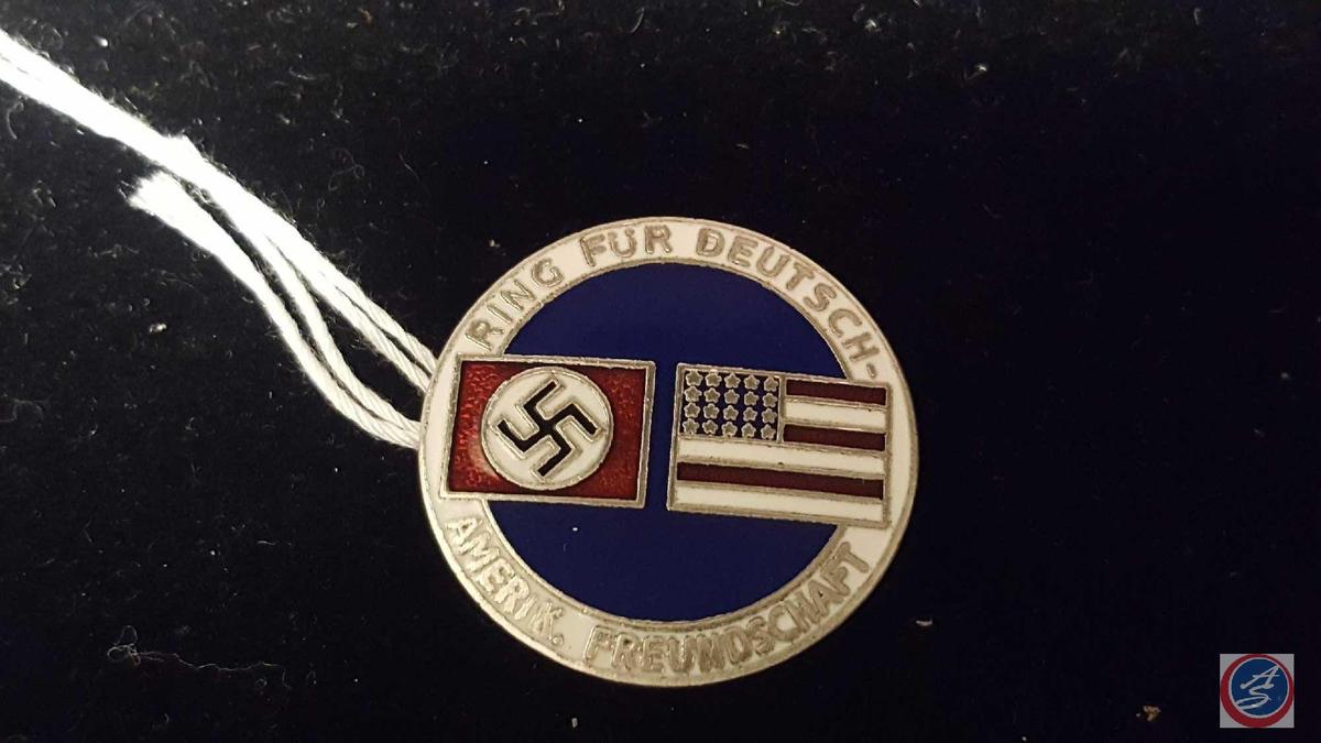 German World War II American Bund Party Badge. Measures 1 1/16 in diameter. The front reads Ring Fur