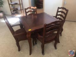 Dining Table Measuring 40" X 40" X 29.5" with (4) Rolling Chairs Made in Malaysia Measuring 39"